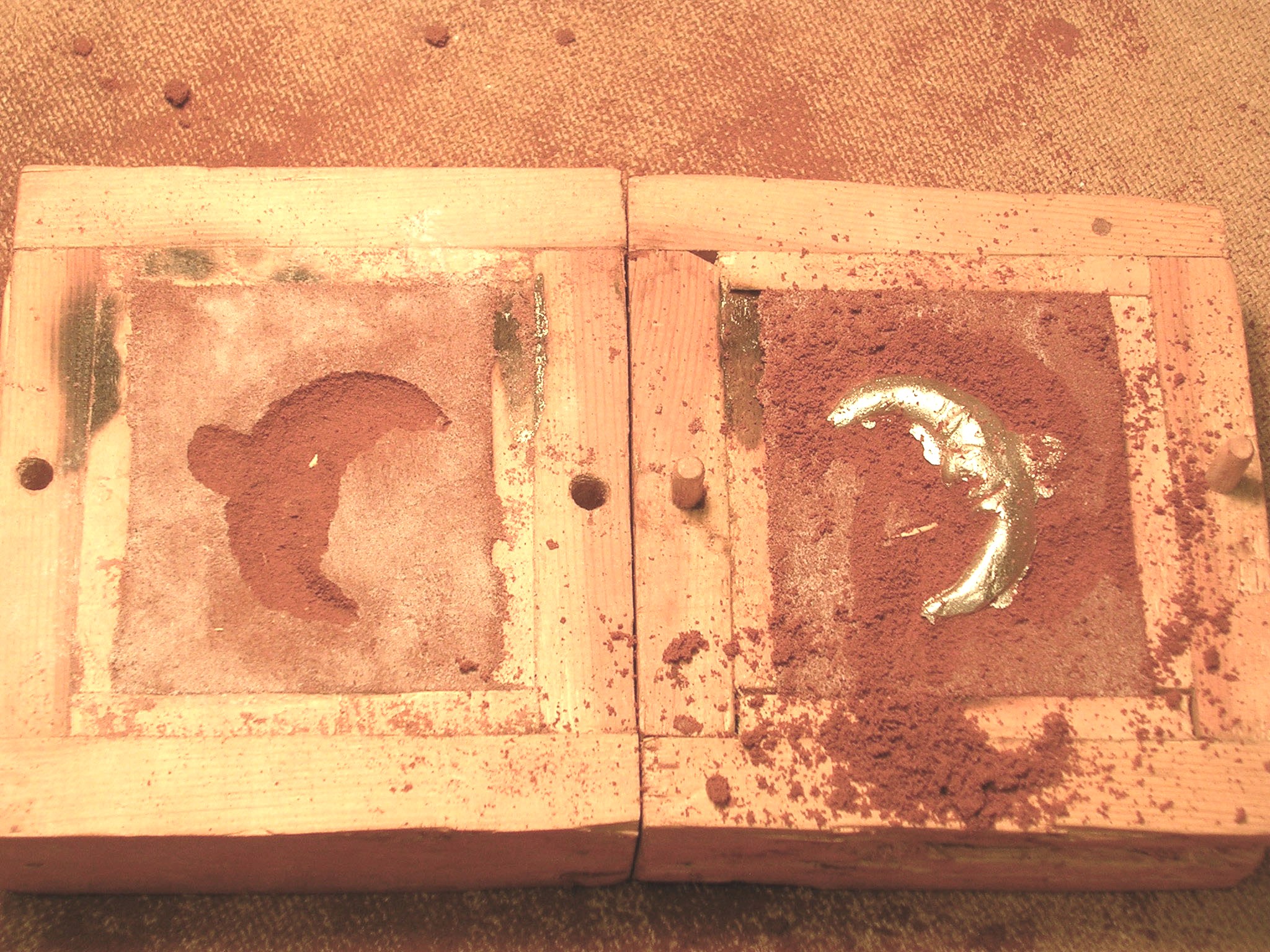 sand mold with pewter casting