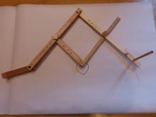 4 wood sticks forming a parallelogram