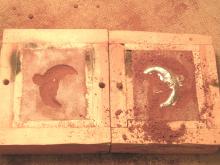 sand mold with pewter casting