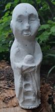 Jizo sculpture inspired by japanese figures to protect children and travelers.